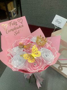 pink and white flowers in a bouquet with congratulations cards