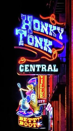 a neon sign that says honky tonk central