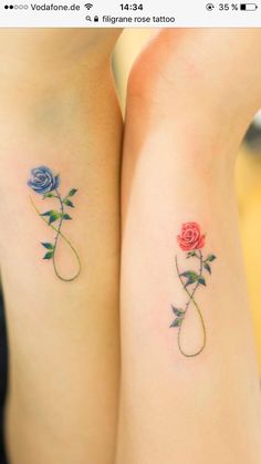 two rose tattoos on both legs, one is blue and the other has pink roses