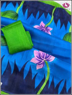 Bishnupuri Silk is a raw form of pure mulberry silk known for its soft, lightweight and smooth texture. They are originally from Bishnupur, a town in West Bengal, India. They come in vibrant colors. This very pretty blue and green Bishnupuri silk saree has hand-painted Buddha on the pallu. The borders feature painted small hand-painted Lotus pods. The saree is soft and very lightweight and easy to drape. It comes with an unstitched plain green blouse piece. Fall and Pico - Done Blouse - Unstitch Traditional Blue Saree With Batik Print, Traditional Blue Batik Print Saree, Blue Raw Silk Saree With Kalamkari Print, Silk Saree With Block Print In Blue, Blue Silk Saree With Block Print, Blue Cotton Silk Saree With Kalamkari Print, Blue Block Print Tussar Silk Saree, Blue Katan Silk Dupatta With Kalamkari Print, Blue Katan Silk Saree With Kalamkari Print