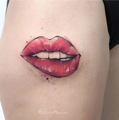 a woman's stomach with a red lip painted on it