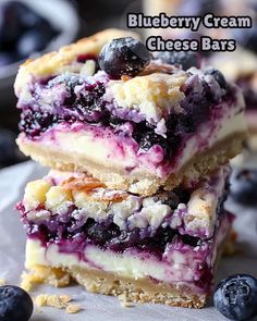 blueberry cream cheese bars stacked on top of each other