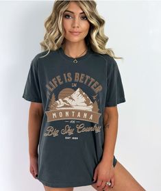 "This is a unisex sized comfort colors t-shirt with an outdoorsy Western vibe and a fun Montana inspired design. It is a high quality and durable material - famous for it's \"worn-in\" look and vintage inspired muted color options. This Montana t shirt is a great gift/perfect for the outdoorsy people in your life.  SIZE UP 1-2 SIZES FOR A TRENDY, LOOSE FIT!  PLEASE NOTE  *Product Description * 100% ring spun cotton Soft washed garment dyed fabric Double needle collar Twill taped neck and shoulde Trendy Outdoor Relaxed Fit T-shirt, Trendy Relaxed Fit T-shirt For Outdoor, Casual Slogan T-shirt For Outdoor, Outdoor Relaxed Fit T-shirt With Text Print, Trendy Outdoor Graphic Print T-shirt, Relaxed Fit T-shirt With Text Print For Outdoor, Relaxed Fit Text Print T-shirt For Outdoor, Relaxed Fit Text Print Top For Outdoor, Relaxed Fit Top With Text Print For Outdoor