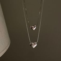 This pendant necklace features a chunky heart design with a minimalist aesthetic. The pendant is made from high quality materials and hangs from a delicate chain, making it a perfect everyday accessory. The heart pendant is simple and stylish, making it a great choice for those who love understated elegance. The chunky design adds a touch of texture to your look, while the minimalist style keeps things refined and sophisticated. Material: Steel. Stamp Necklace, Birthday Necklace Gift, Stamped Necklaces, Heart Necklaces, Silver Heart Pendant, Jewelry Birthday, Trendy Necklaces, Birthday Jewelry Gift, Body Chain Jewelry