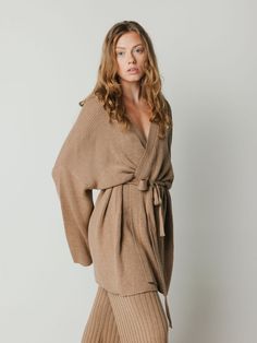 Wrap kimono cardigan in merino wool with open front, attached belted waist, and flared sleeve. Chic Fall Kimono For Daywear, Chic Long Sleeve Belted Robe, Chic V-neck Sweater Coat For Daywear, Chic Fall Kimono For Loungewear, Chic Fall Loungewear Kimono, Belted Long Sleeve Kimono For Loungewear, Long Sleeve Belted Kimono For Loungewear, Fall Loungewear Robe With Kimono Sleeves, Casual Long Sleeve Belted Kimono