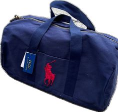 Casual Blue Rectangular Travel Bag, Casual Blue Satchel Travel Bag, Blue Casual Satchel Travel Bag, Blue Gym Bag With Luggage Sleeve For Everyday Use, Casual Blue Duffle Bag For School, Blue Large Capacity Duffle Bag For School, Large Capacity Blue Duffle Bag For School, Blue Rectangular Duffle Bag With Luggage Sleeve, Rectangular Blue Duffle Bag With Luggage Sleeve