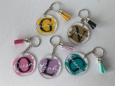 six key chains with different designs on them