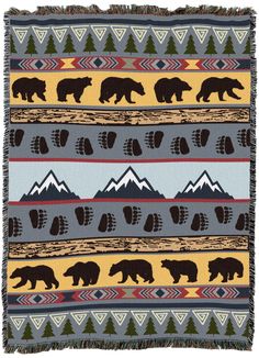 a blanket with bears and mountains on it