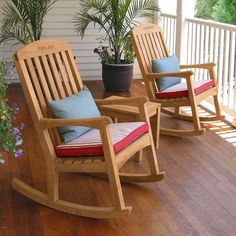 three wooden rocking chairs sitting on a porch