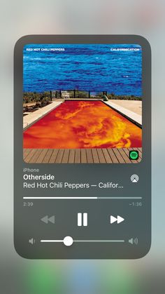 an iphone screen with the image of a pool and music player on it's side