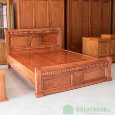 a large wooden bed sitting on top of a white tile floor next to dressers