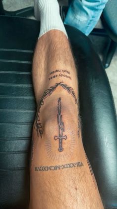 a man with a tattoo on his leg