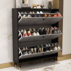 the shoe rack is holding several pairs of women's shoes and has multiple compartments to store them