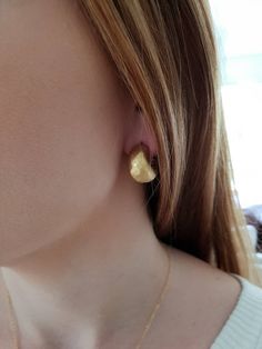 These are wide classic hoop earrings, made out of gold plated brass. Minimalist design handmade earrings. Its a great gift for women and teens. Great present for the holidays or for yourself.. -gold plated brass hoop earrings -Free shipping worldwide -All my jewelry are sent in a gift box To see more of my hoops, please follow this link: https://www.etsy.com/your/shops/TamyZurTachshit/tools/listings/section:25644741,stats:true To see more of my Earrings. please follow this link: https://www.etsy Handmade Gold Brass Huggie Earrings, Handmade Gold Huggie Earrings In Brass, Hammered Small Hoop Huggie Earrings For Gift, Handmade Gold Small Hoop Huggie Earrings, Handmade Gold Huggie Earrings, Handmade Minimalist Gold Plated Huggie Earrings, Gold Hammered Round Huggie Earrings, Hammered Gold Round Huggie Earrings, Gold Small Hoop Plug Earrings For Everyday