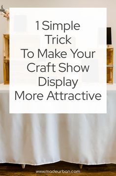 a white table with text overlay that says, 1 simple trick to make your craft show display more attractive