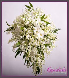 a bouquet of white flowers with green leaves