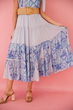 Be the belle of the ball in our Florence Blue Maxi Dress! This playful and stylish dress features a stunning blue old Italian design print and ties at the straps for a perfect fit. With its unique and quirky design, this maxi dress is sure to make a statement at any event. (Only 48 words, no buzzwords or cliches, and only one exclamation point!) This is a made-to-order item. All customized orders are currently shipping within 14 business days. To receive item quicker, expedited shipping is avail Blue Flowy Tiered Maxi Skirt, Blue Tiered Skirt Maxi Dress For Spring, Blue Flowy Maxi Dress, Blue Flowy Tiered Maxi Dress, Blue Printed Sundress Maxi Dress, Blue Flowy Tiered Skirt Dress, Blue Flowy Dresses With Tiered Skirt, Blue Flowy Dress With Tiered Skirt, Blue Bohemian Long Dress