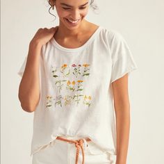 This Tee-Shirt Offers A Living Touch To Everyday Looks. Pullover Styling, Organic Cotton, Machine Wash. Pit To Pit 23”, Length 23”/25” Relaxed Graphic Print Tops For Spring, Relaxed Everyday Spring Tops, Everyday Graphic Tee For Spring, White Relaxed Tops With Graphic Print, White Relaxed Top With Graphic Print, Relaxed White Tops With Graphic Print, Relaxed White Top With Graphic Print, White Relaxed Fit Top For Spring, Flowy Tunic Tops