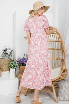 Adorable mod dot floral print dress. Bubble sleeves. Tiered style is very flattering. Stretchy and anti-wrinkle polyester and spandex blend material. Dress measures 50" in length. Fullest Part of Bust Measurement: Small: 38" Medium: 40" Large: 42" 1XL: 44" 2XL: 46" 3XL: 48" Pink Floral Print Maxi Dress With Short Sleeves, Casual Pink Ditsy Floral Maxi Dress, Pink Ditsy Floral Maxi Dress, Pink Floral Printed Short Sleeve Dress, Pink Ditsy Floral Print Maxi Dress, Pink Knee-length Floral Sundress, Floral Print Knee-length Smocked Dress For Daywear, Pink Floral Print Knee-length Dress, Pink Ditsy Floral Print Knee-length Dress