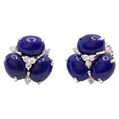 These stunning pair of earrings feature sets of oval cabochon-cut lapis lazuli adorned with round simulated diamonds, handset in platinum rhodium plated silver. The lapis lazuli offer rich blue hue with unique beautiful pattern. Straight post with large friction earring back allowing the earrings to sit well on the ear. The earrings measured 1/2" height and across. Mark: "NUM 925" Gorgeous gemstone earrings! Great for everyday wear! A must have! Also available in yellow gold color or other gemst Vintage Stud Earrings, Lapis Lazuli Jewelry, Earrings For Sale, Jewelry Diamonds, Earrings Stud, Oval Cabochon, Earring Backs, Jewelry Earrings Studs, Beautiful Patterns