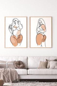 two framed nude women on the wall in a living room