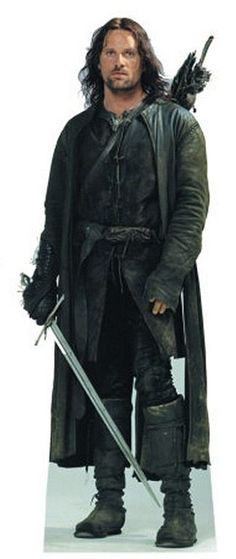 a man dressed in black is holding two swords and standing with one hand on his hip