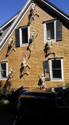 skeleton decorations on the side of a house