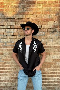 Your BF is about to look his best in the Danica Button Up Top. A classic silhouette with standout details, this black shirt with a white flame pattern is essential in every guy’s closet. Country Music Festival Outfits, Flame Pattern, Festival Outfits Men, Party Bottoms, Concert Dresses, 12th Tribe, Denim And Diamonds, Bridal Tops, Music Festival Outfits