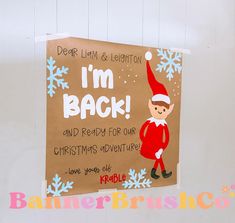 a sign with an elf on it that says i'm back and ready for our christmas adventure