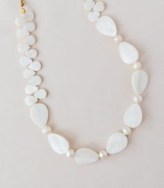 * Use discount FOURITEMS to get 10% off when you purchase 4 items or more across all our products (jewelry, ceremony items, etc) * Designed and handcrafted in the Philippines by Filipino artisans in Cebu * Made of genuine, sustainably sourced capiz shell, mother of pearl with cultured pearl, and stainless steel * Length: 20 inches * Free of lead and nickel * Materials are locally and ethically sourced to support traditional Filipino crafts with minimal interference with the natural habitat * Eac Bohemian Hand-strung Pearl Jewelry, Artisan Teardrop Wedding Jewelry, Adjustable Artisan White Jewelry, Adjustable White Artisan Jewelry, Adjustable Teardrop Pearl Jewelry, Elegant Long White Shell Necklace, Elegant White Long Shell Necklace, White Artisan Long Necklace, Bohemian Teardrop Pearl Jewelry