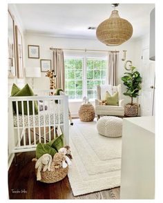 a baby's room is decorated in white and green