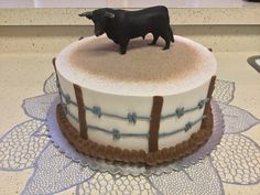 there is a cake with a cow on top