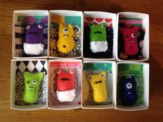 six different types of stuffed animals in small boxes