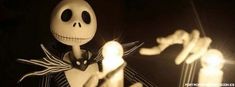 an animated skeleton holding a lit candle in the dark