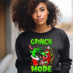 Ready for the holidays with these cute little grinch mode tee's Available in t-shirts or sweatshirts  Cotton blend Various sizes available Grinch Tee Shirts, Christmas Grinch Tshirt, Cheerleader Grinch Shirts, Christmas Tee Shirts Grinch, Womens Grinch Shirt, Grinch Shirts, The Grinch Movie, Ew People, Christmas Outfits Women