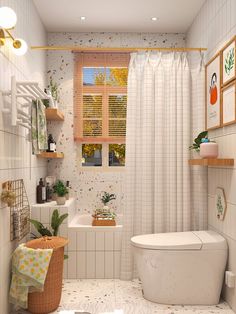 a bathroom with a toilet, sink and bathtub next to a window filled with plants