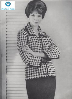 an old black and white photo of a woman in a skirt with her arms crossed