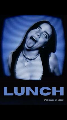 a woman laughing in front of a tv with the words lunch on it's screen