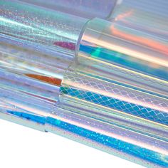 the inside of a clear tube with blue and pink holographics on it