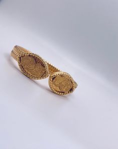 This Traditionally hand-crafted cuff bracelet in lustrous gold purity stands testament to its impeccable quality and artistry. a timeless piece of treasure in 37.20 grams of 21k gold Luxury Gold Cuff Bracelet For Ceremonial Use, Luxury Gold Cuff Bracelet For Ceremonial Occasions, Luxury Gold Cuff Bracelet For Wedding, Luxury 22k Gold Bracelet For Formal Occasions, Ceremonial Yellow Gold Hallmarked Cuff Bracelet, Luxury 22k Gold Formal Bracelet, Formal 22k Yellow Gold Cuff Bracelet, Hallmarked Yellow Gold Cuff Bracelet For Formal Occasions, Luxury Yellow Gold Ceremonial Bracelets