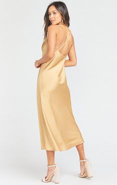 The Verona is your DREAM satin and silky cowl neck dress, she is cut on the bias for that perfect slipdress draping. This dress features adjustable straps, a cowl neck and a crisscross back. Sleeveless Silk Sleep Slip Dress, Sleeveless Silk Slip Dress For Sleep, Gold Chic Slip Dress With Spaghetti Straps, Silk Spaghetti Strap Sleep Dress, Satin Sleep Dress With Spaghetti Straps, Chic Gold Slip Dress With Spaghetti Straps, Spring Satin Midi Dress With Cowl Back, Satin Finish Spaghetti Strap Sleep Dress, Silk Slip Dress With Satin Finish For Sleep