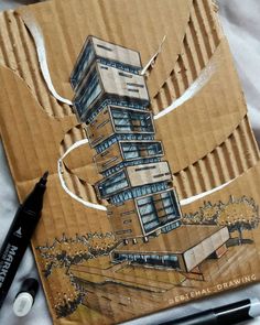 a piece of cardboard with a drawing of a building on it