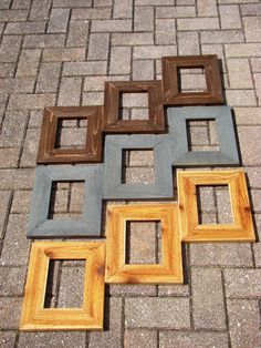 several different colored frames sitting on the ground