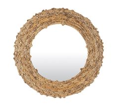 a circular mirror made out of branches on a white background with reflection in the middle