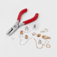 a pair of pliers and other tools on a white surface