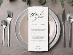 a place setting with silverware and a thank card on the plate next to it