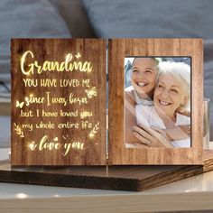 a wooden frame with the words grandma you have loved me and an image of two women