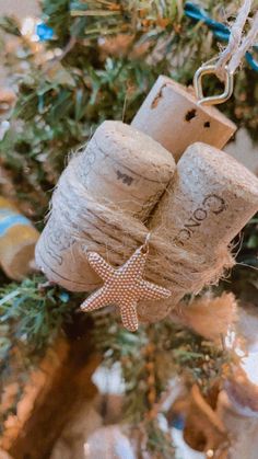 two wine corks hanging from a christmas tree