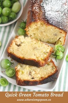 sliced loaf of quick green tomato bread on a plate with peas and grapes in the background