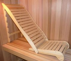 a wooden chair sitting on top of a wooden shelf